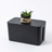 Black cable management box, white background