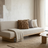 Russet chunky knit pillow on a sofa