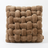 Chunky knit accent pillow in russet, white background