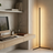 Modern home office with a desk, computer monitor, and lamp.