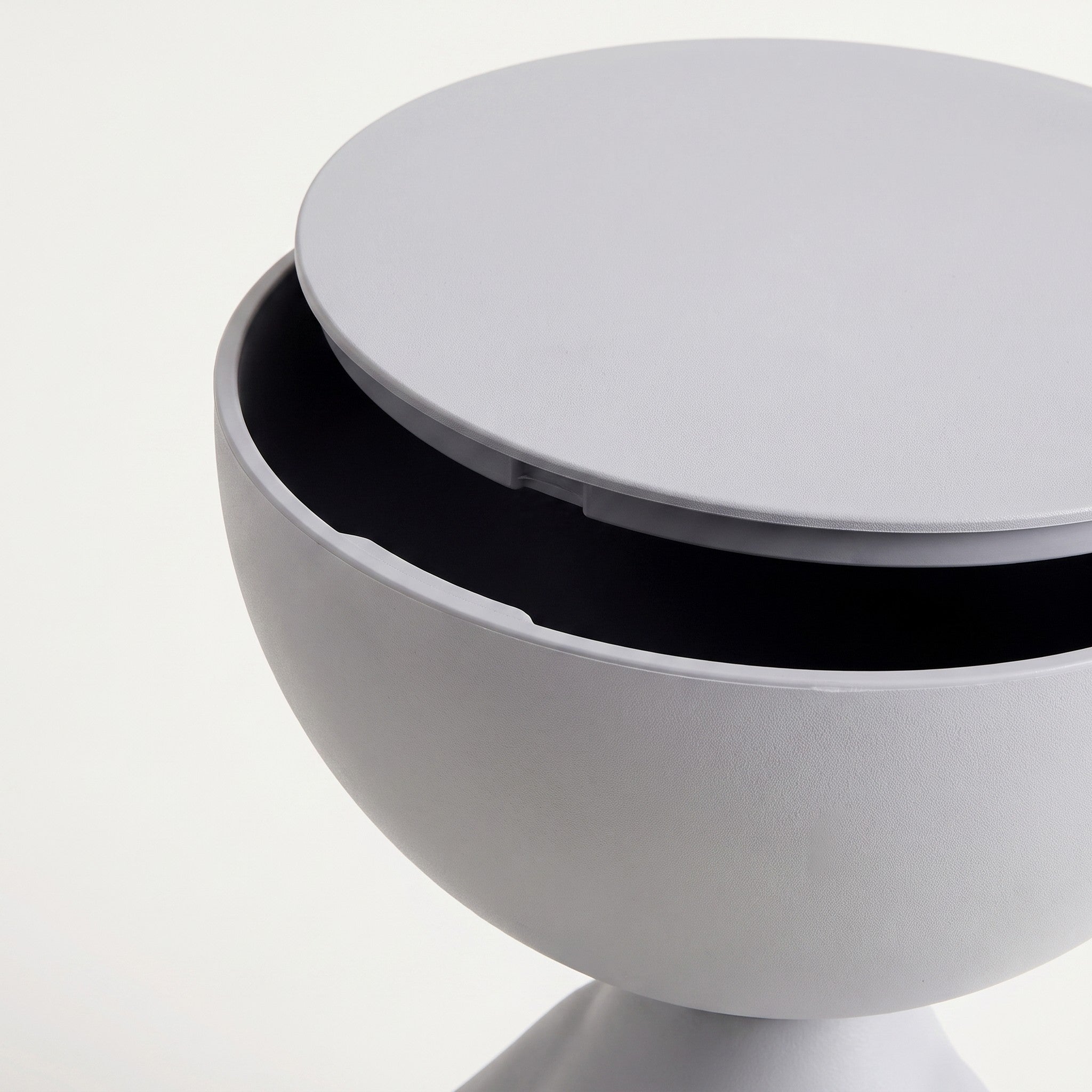 Close-up of the lift-off lid on the bowl-top storage end table revealing the storage well