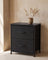 Fabric drawer nightstand in a warm minimalist bedroom setting