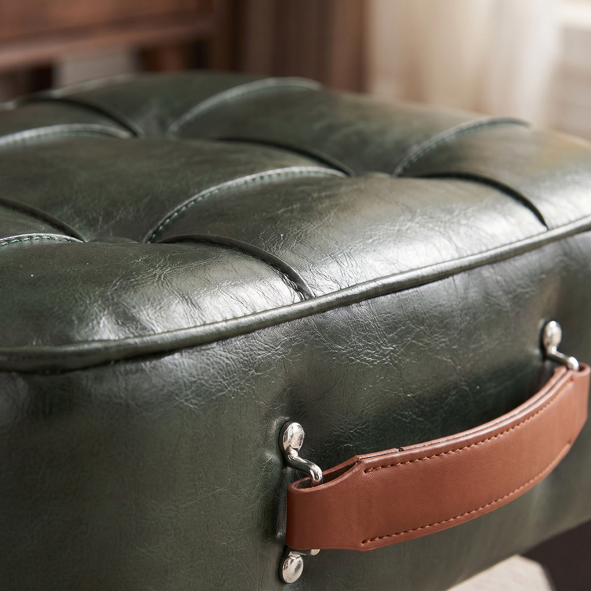 Close-up detail of tufted faux leather ottoman
