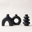 Sculptural ceramic vase in black on white background