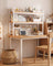 Grid-back desktop bookshelf in a warm minimalist workspace