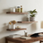 Home office with wooden desk, shelves, and decor