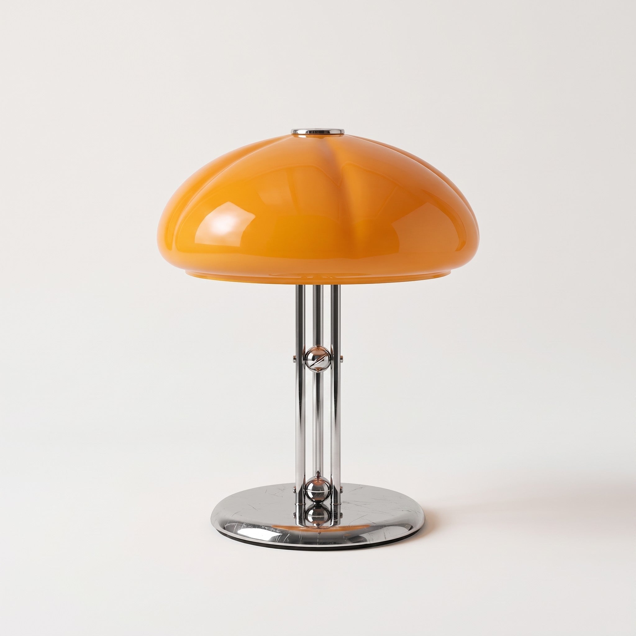 Close-up of chrome tripod glass dome lamp base and shade