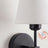 Close-up of cordless fabric shade wall sconce texture in black