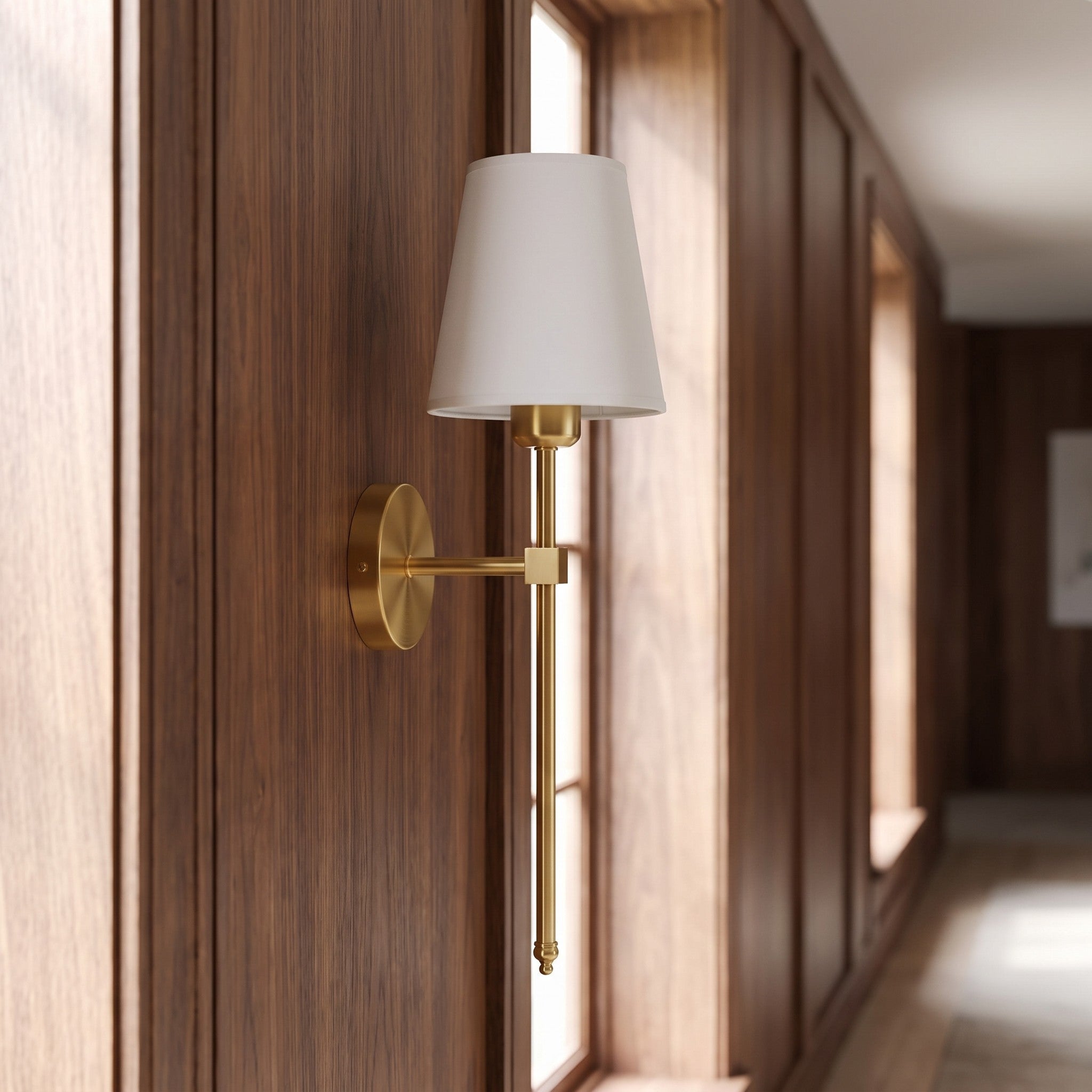 Gold cordless fabric shade wall sconce in a hallway scene