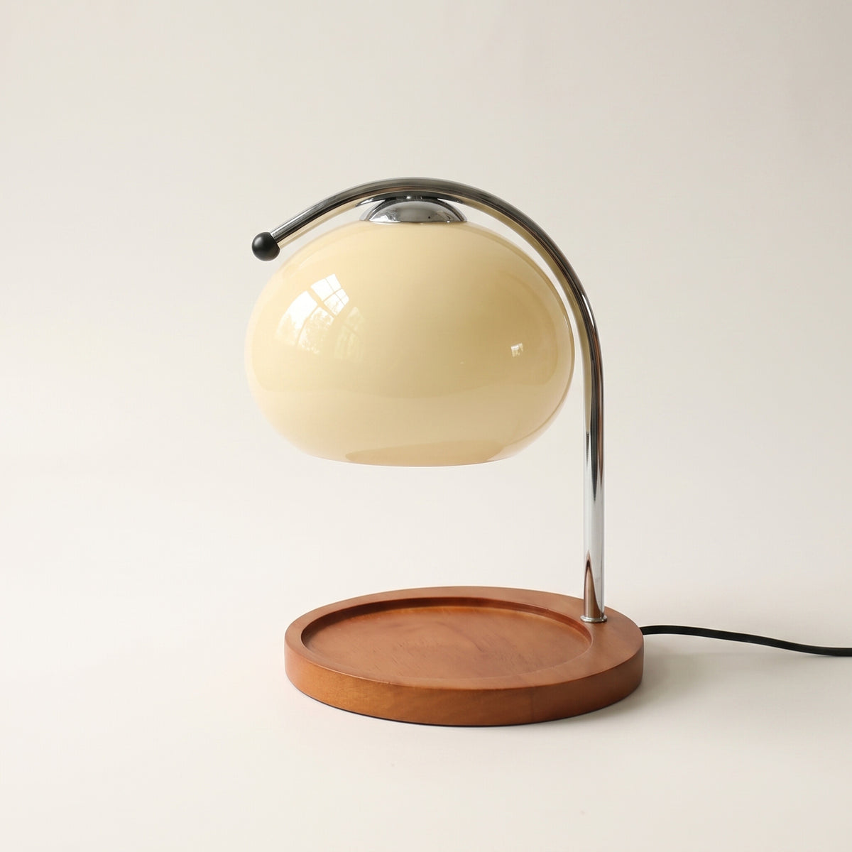 Glass candle warmer lamp in milky white, shown alone with an empty base on a plain off-white background