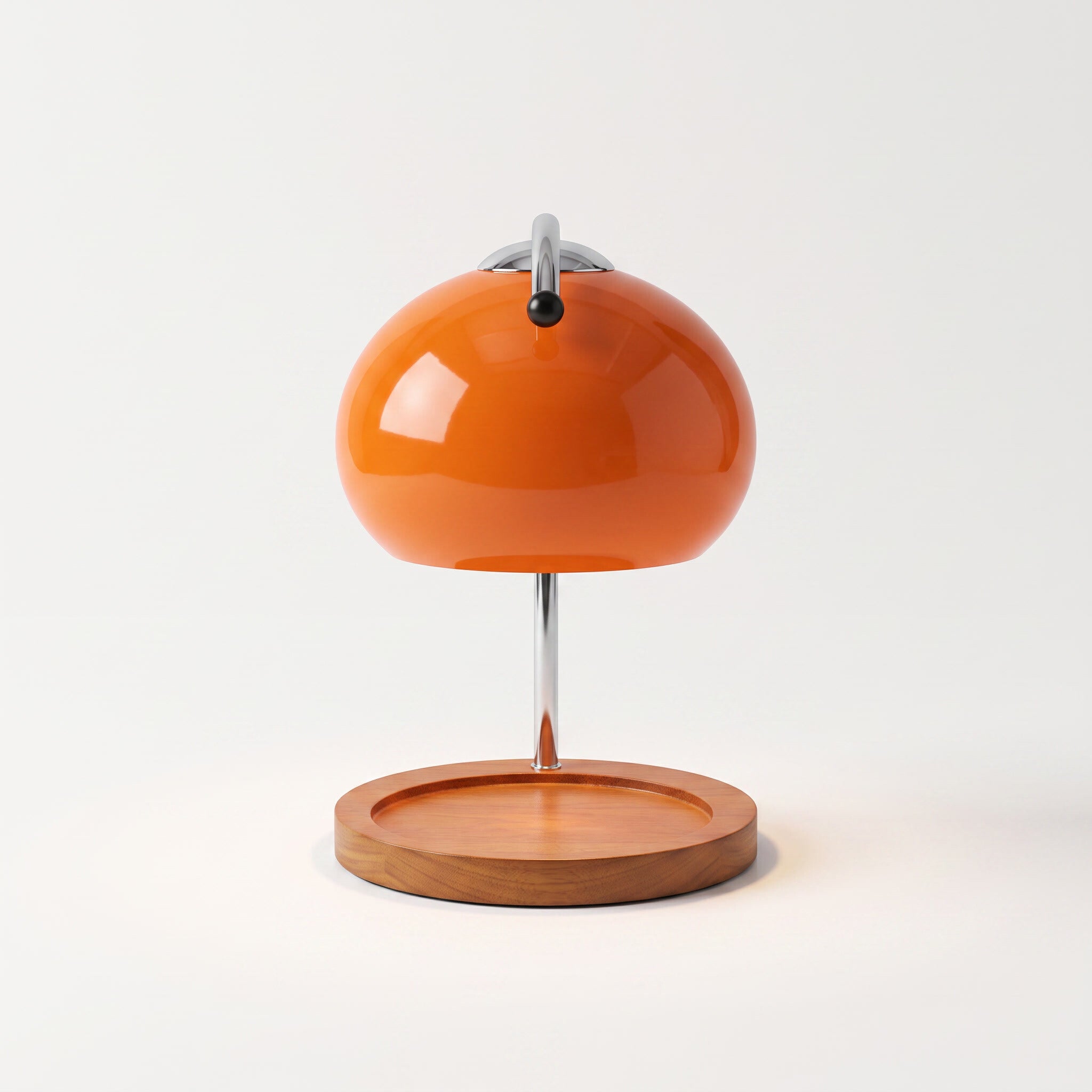 Glass candle warmer lamp in orange, shown alone with an empty base on a plain off-white background