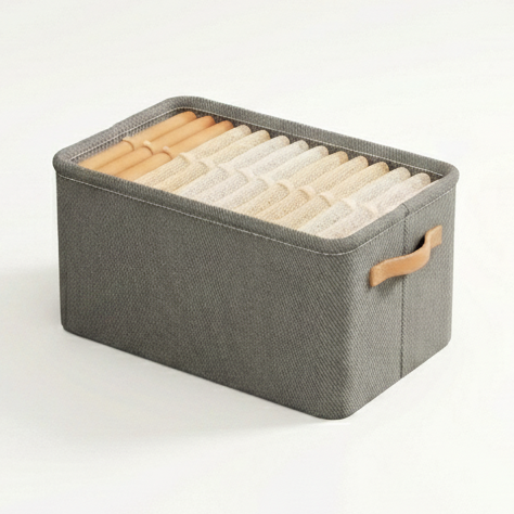 Gray storage box with a brown handle on a white background