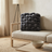 Grey chunky knit pillow on a sofa