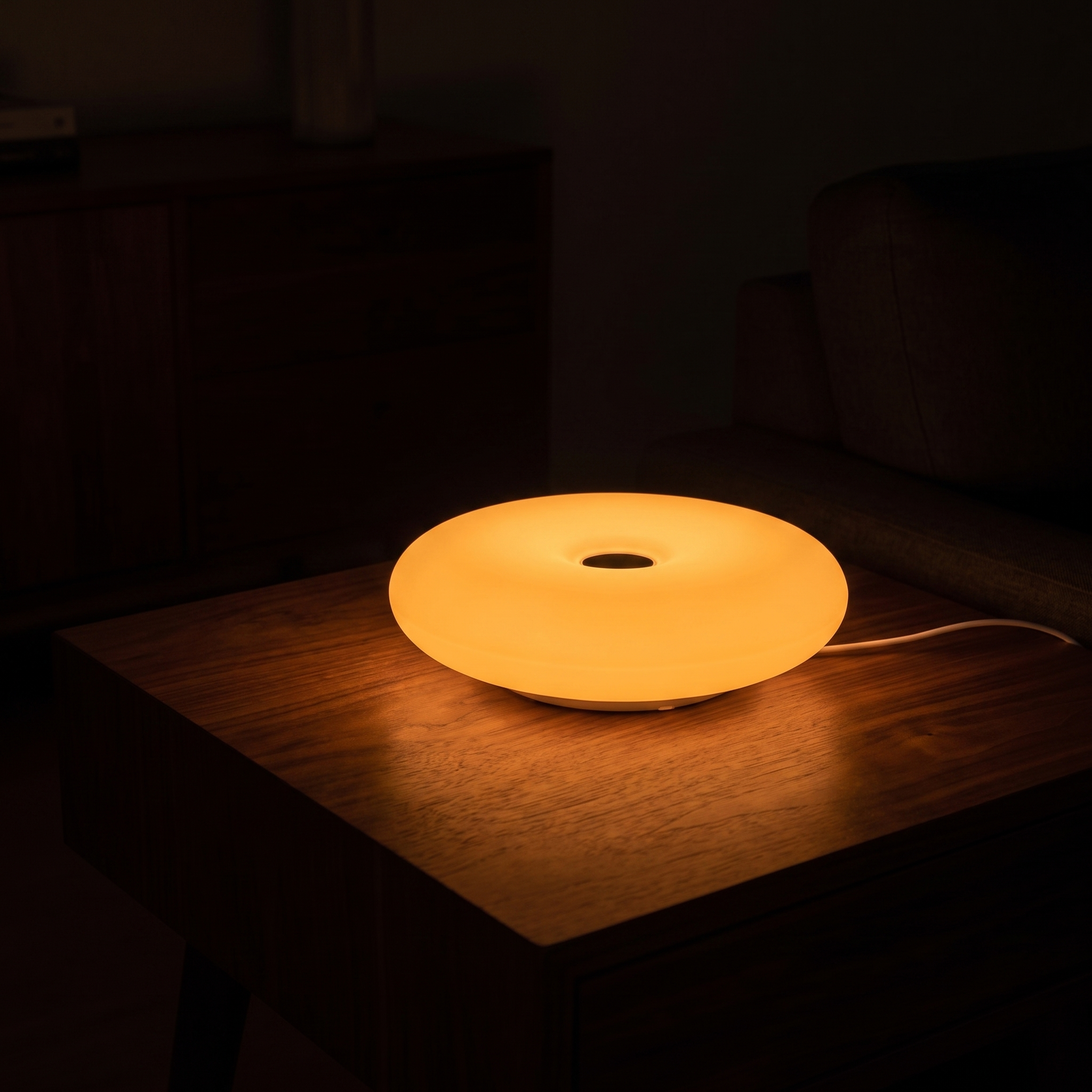 Frosted Donut Table Lamp, Orange, lit room scene