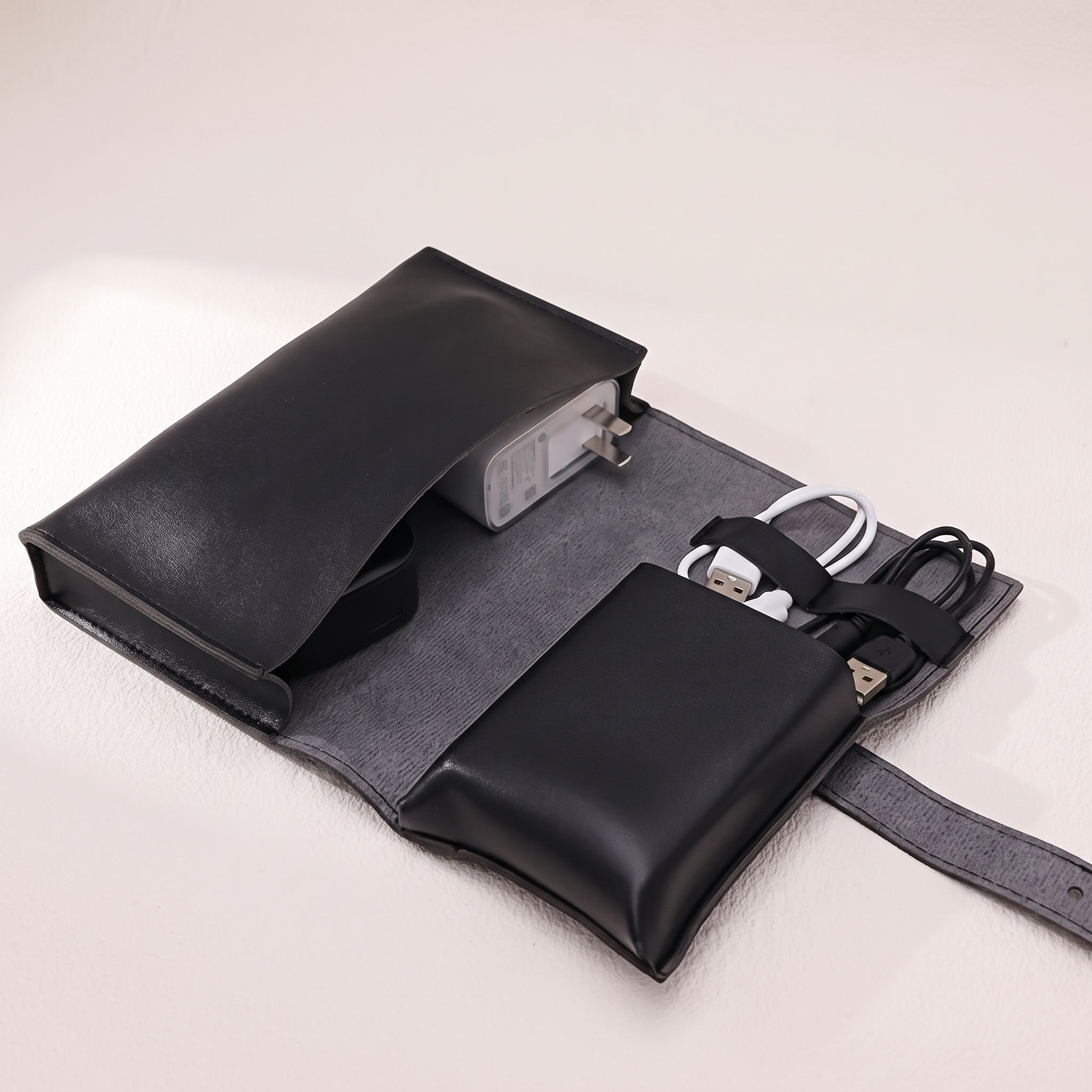 PU Leather Tech Organizer Case in black, studio product photo on off-white background