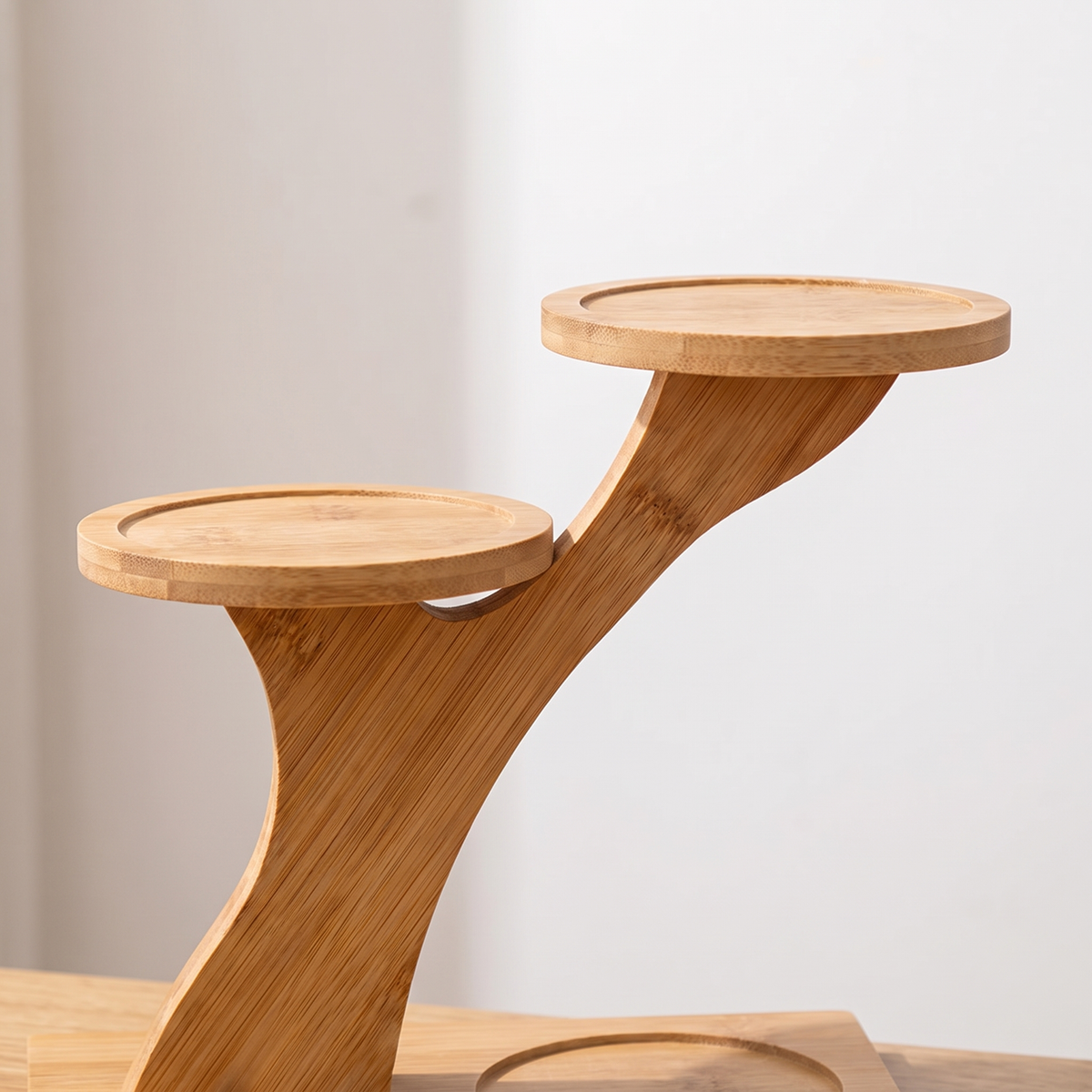 Close-up of the 2-Tier Bamboo Display Shelf showing the shelf structure and bamboo grain