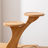 Close-up of the 2-Tier Bamboo Display Shelf showing the shelf structure and bamboo grain