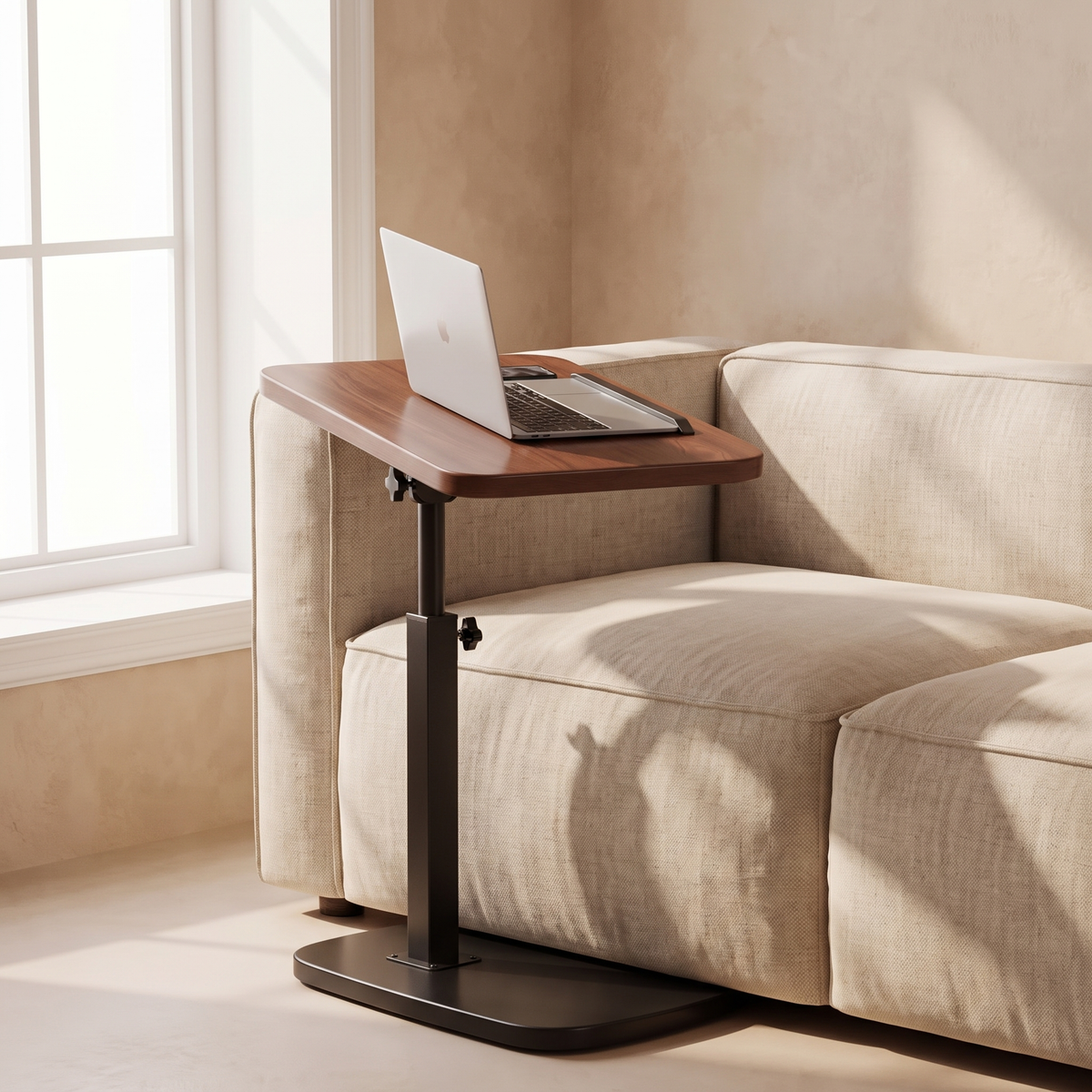 Height-Adjustable C-Shaped Side Table beside a linen sofa with a laptop resting on its tilted top