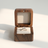 Wood Ring Box, Beige Interior, open on its hinge showing the velvet-lined interior with a ring