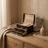 Arched three-layer jewelry box, black finish, styled in a room scene