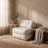 Compact corded fabric chair bed, white, styled in a warm room scene