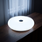 Frosted Donut Table Lamp, White, dark lit scene on walnut console