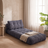 Compact corded fabric chair bed unfolded flat into its full sleeping bed form, styled in a guest-room scene