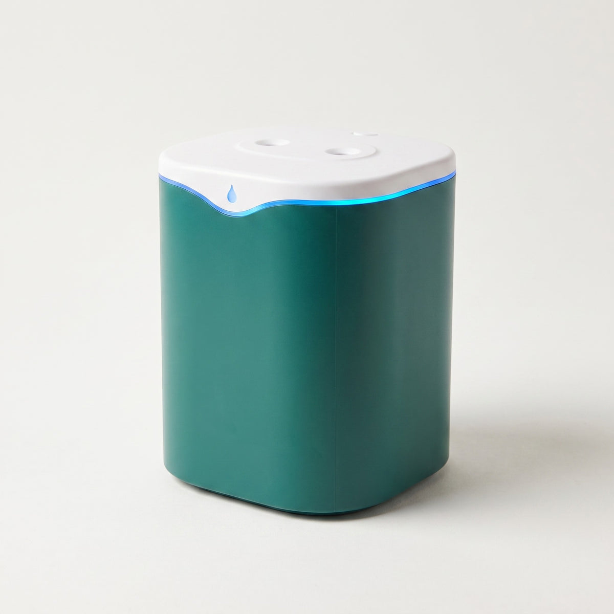 Green cordless dual-nozzle USB humidifier with green top and body, on a plain off-white background