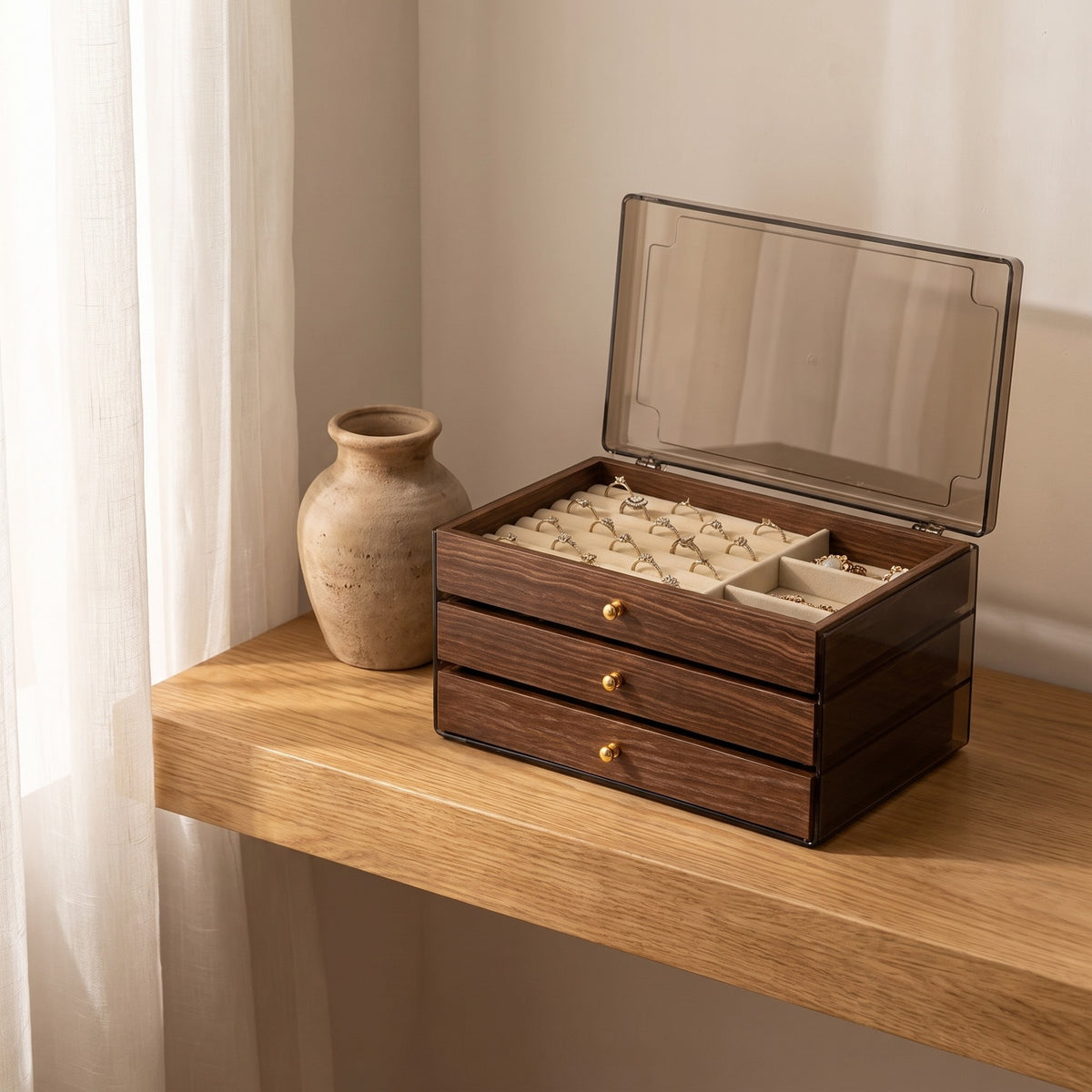 Warm Wood-Grain Tiered Jewelry Box open on a white oak vanity shelf in daylight beside a ceramic vase.