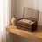 Warm Wood-Grain Tiered Jewelry Box open on a white oak vanity shelf in daylight beside a ceramic vase.