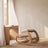 Ergonomic Rocking Kneeling Chair in a calm home workspace with a limewash plaster wall and white oak desk.