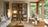 Modern living room with wooden bookshelf, sofa, and armchair.