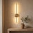 Wall bar lit above a white oak console, warm light on a plaster wall