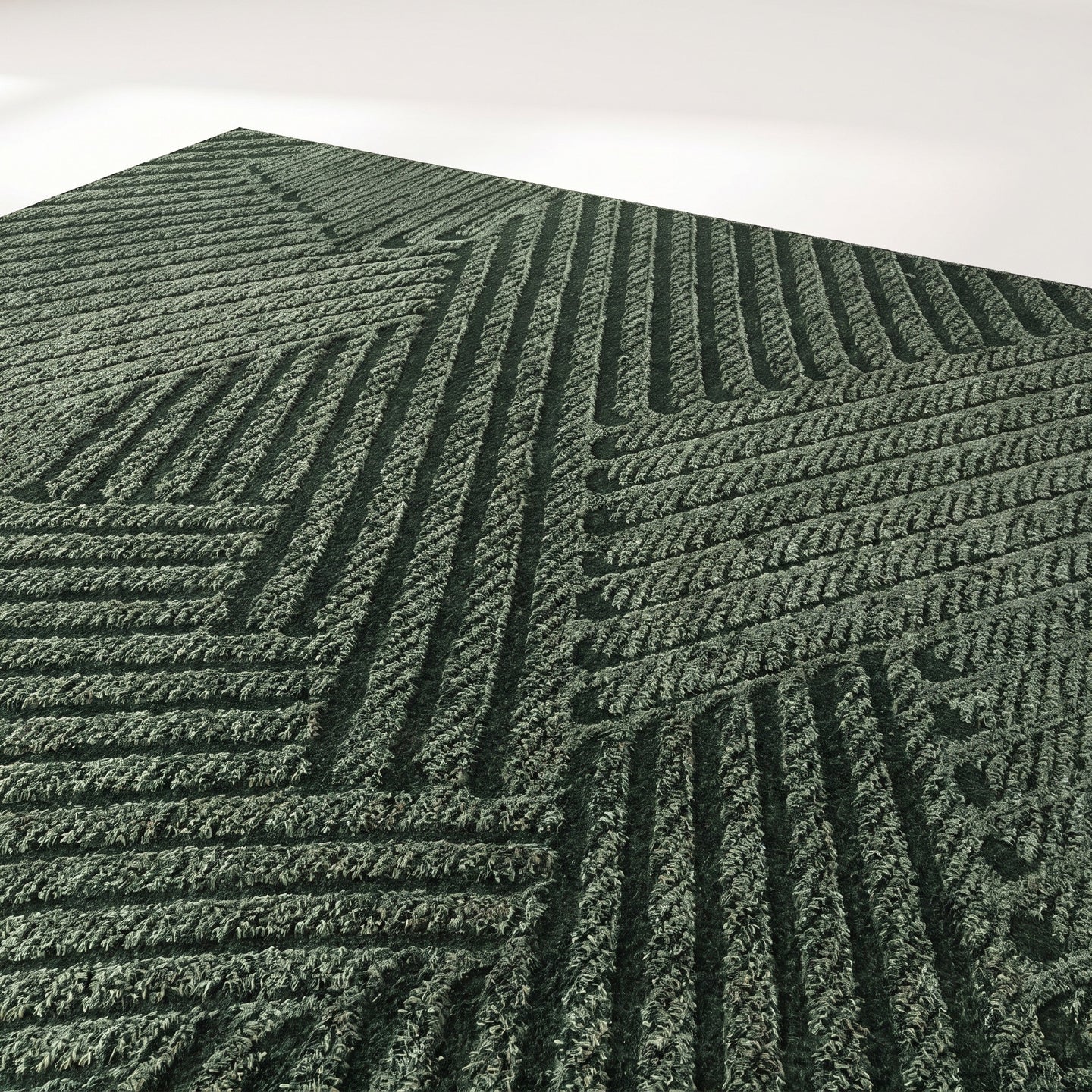 Close-up of textured non-slip entry mat surface in green