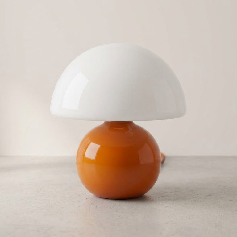 Opal Glass Mushroom Table Lamp on a soft off-white studio background, glossy orange base and opal dome