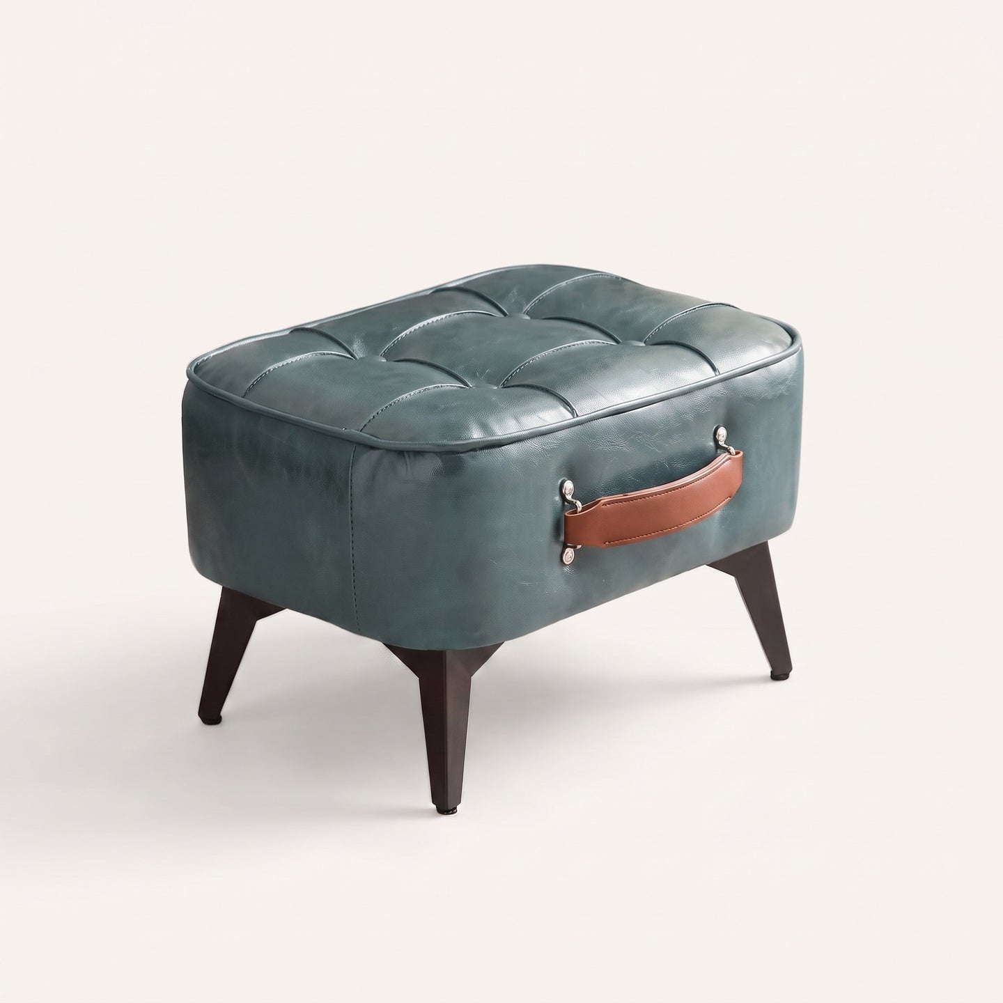 Tufted faux leather ottoman in azure green, white studio packshot