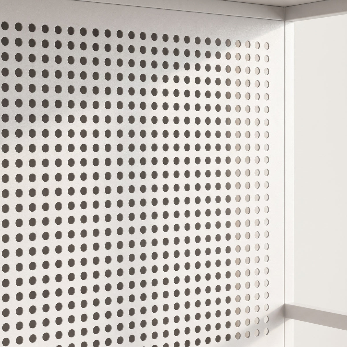 Close-up detail of the pegboard-back panel