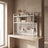 Pegboard-back desktop bookshelf in a plaster-wall entryway scene