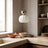 Single-head chrome pumpkin pendant light in a kitchen scene