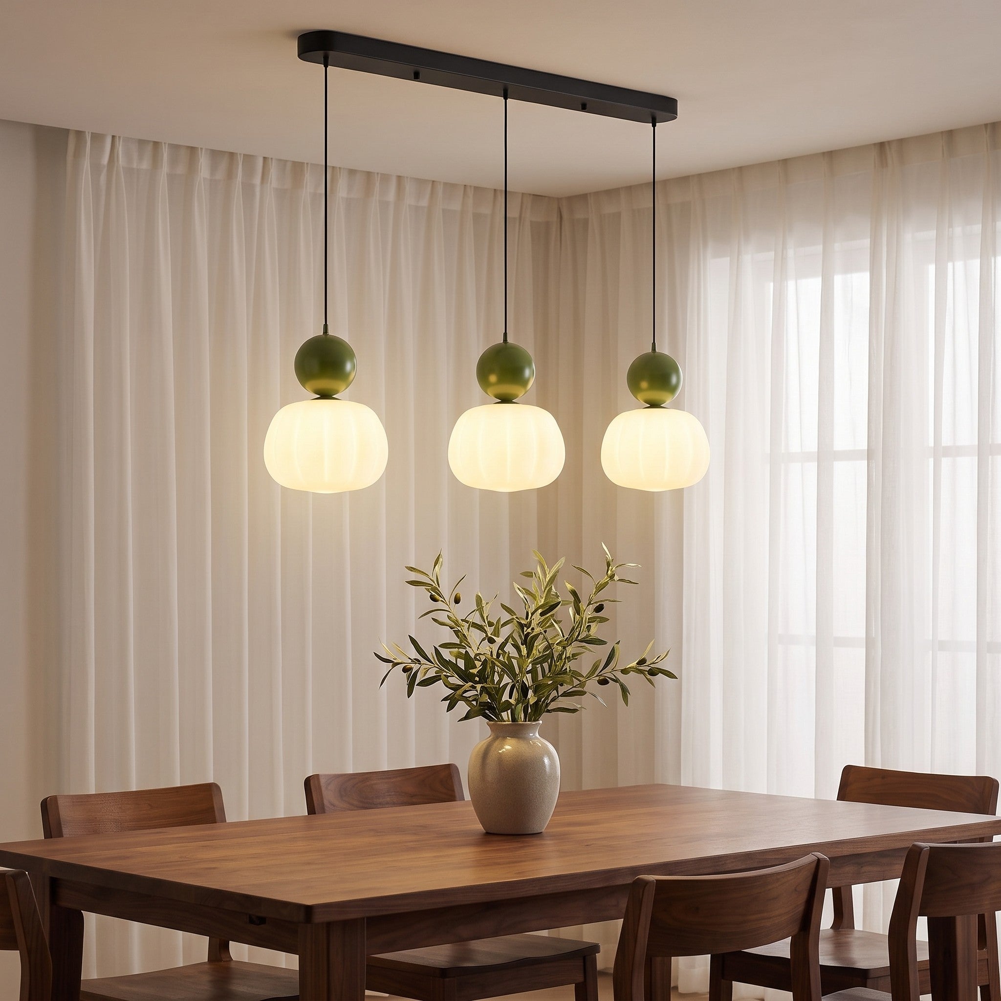 Three-head green pumpkin pendant light in a dining room scene
