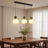 Three-head green pumpkin pendant light in a dining room scene
