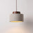 Stone-look pendant, wide shade with a dark wood cap, lit