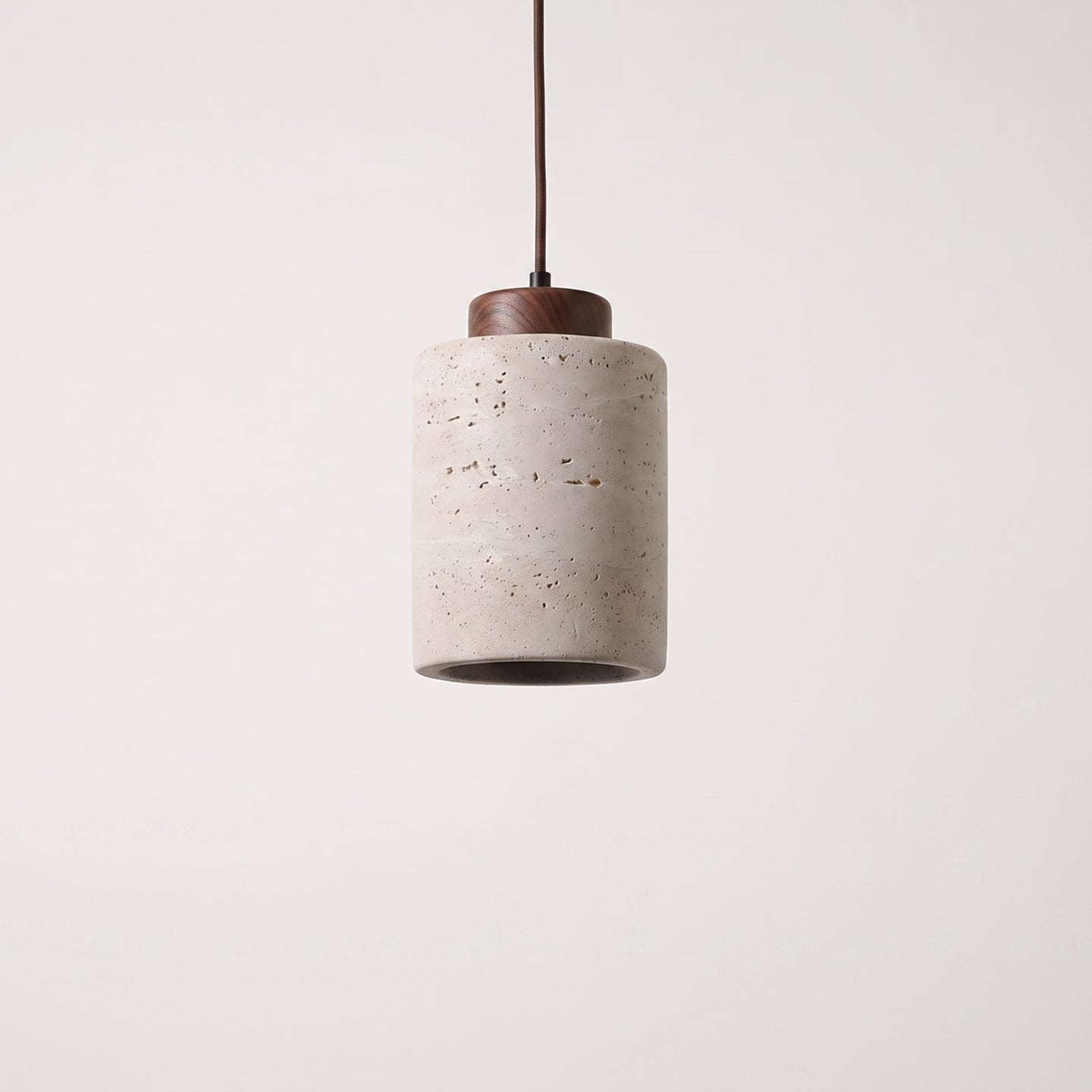 Stone-look cylinder pendant with a dark wood cap, studio packshot