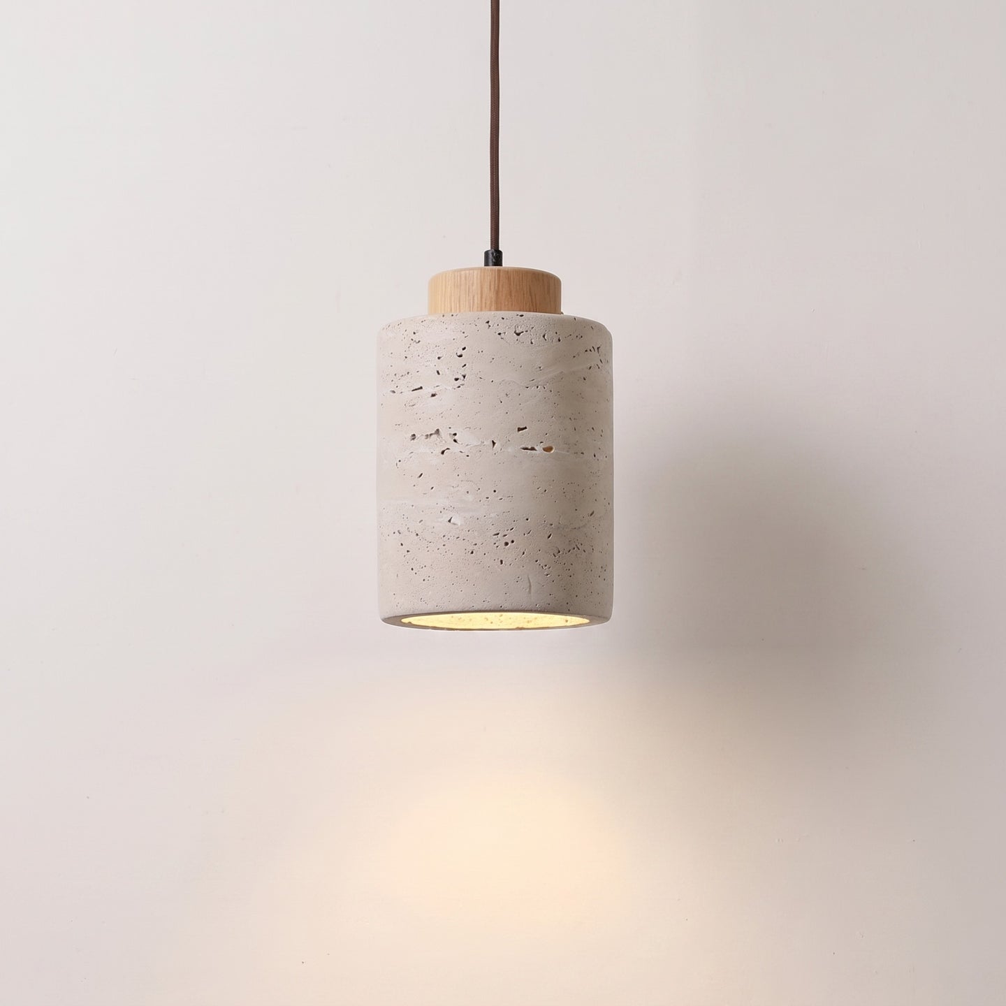 Stone-look pendant, tall shade with a natural wood cap, lit