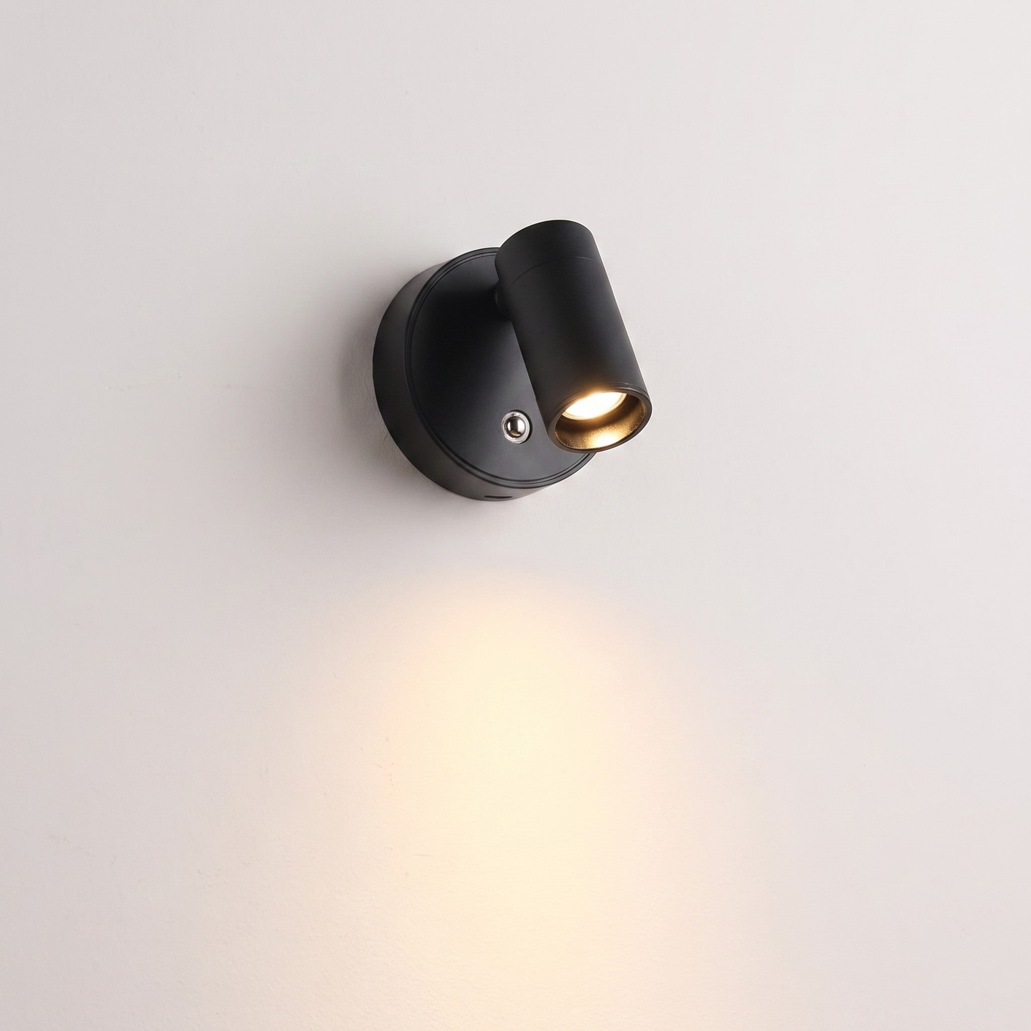 Touch-dim magnetic reading light in black, lit