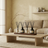Living room with a beige sofa, wooden coffee table, and decorative items.