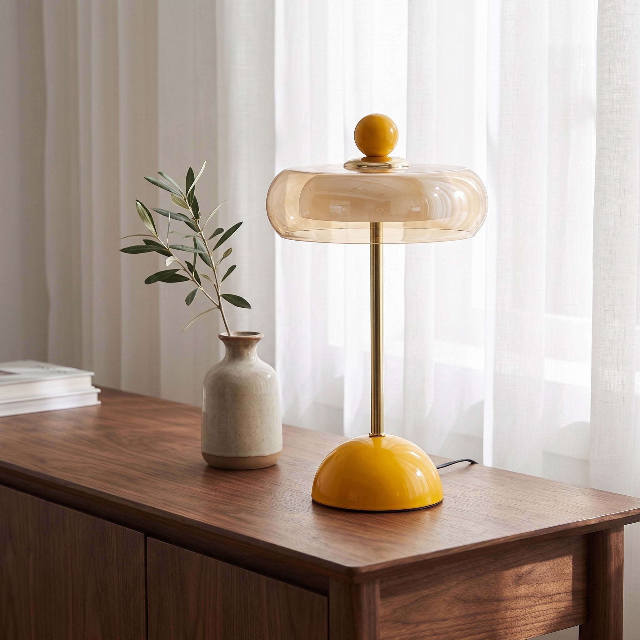 Yellow glass ring table lamp styled on a console table scene