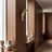 Champagne wall sconce styled in a hallway scene