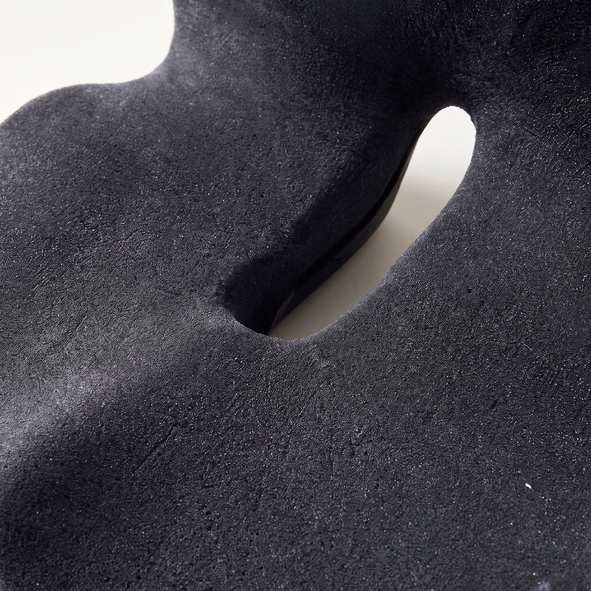 Contoured memory foam seat cushion, foam and cutout detail