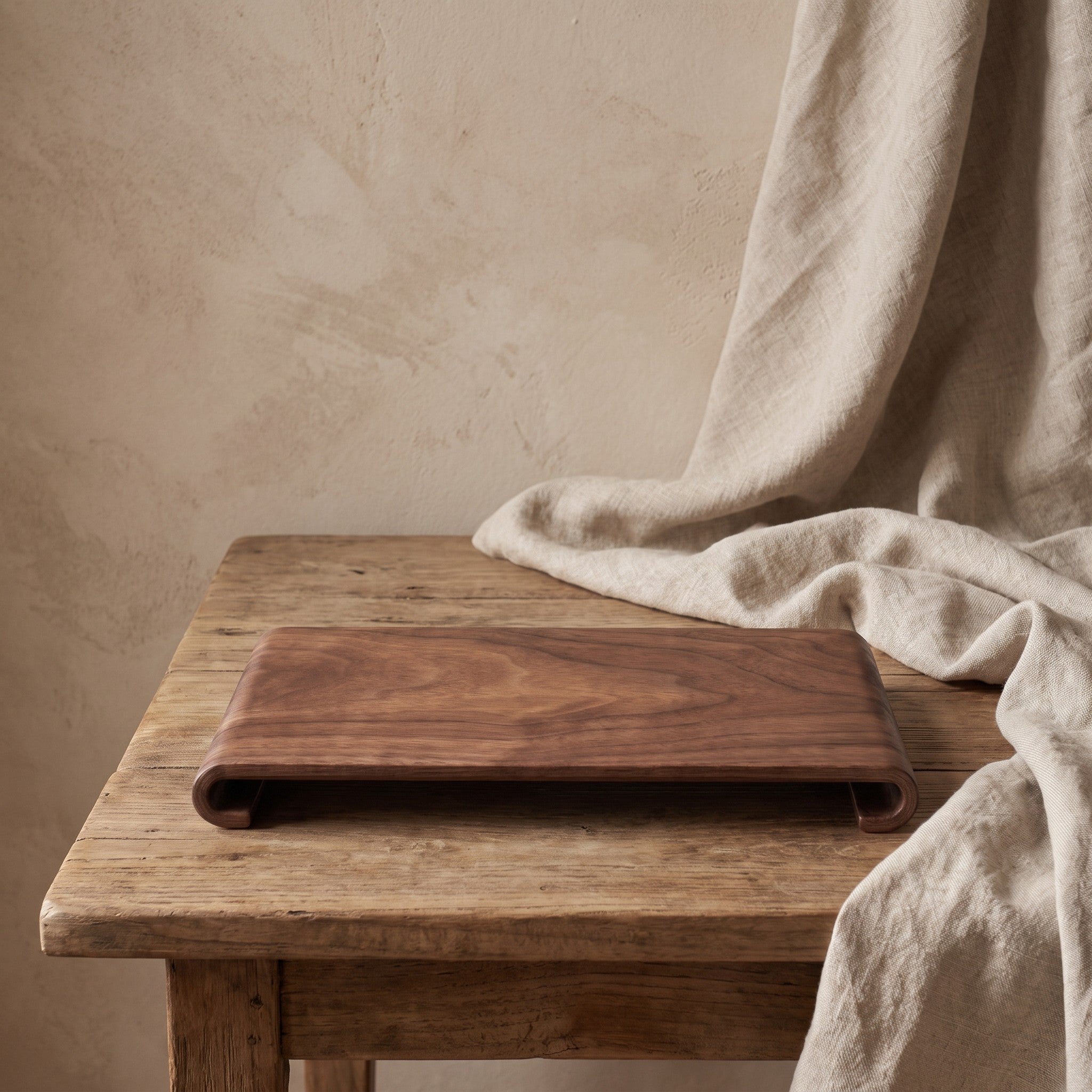 Rectangular wood serving tray styled on a table
